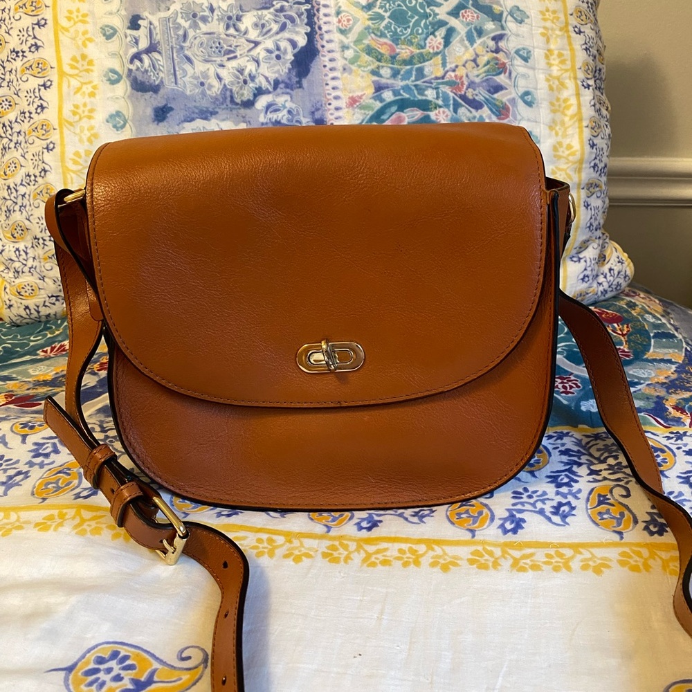 Beautiful Cognac color leather purse designed to hold an SLR camera